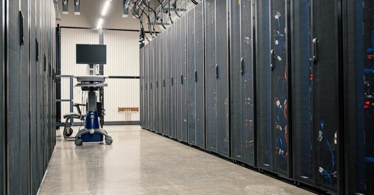 Steel framework cabinets housing servers networking devices and cables in contemporary equipped data center