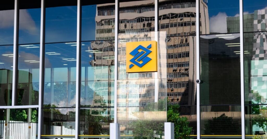 Modern building exterior in Brasília, Brazil, featuring reflective glass and iconic Banco logo. Logo Banco do Brasil em agência em Brasília. BB