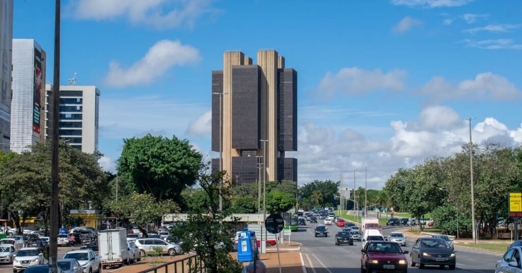 Street view in Brasilia featuring the Central Bank of Brazil under a vibrant sky.